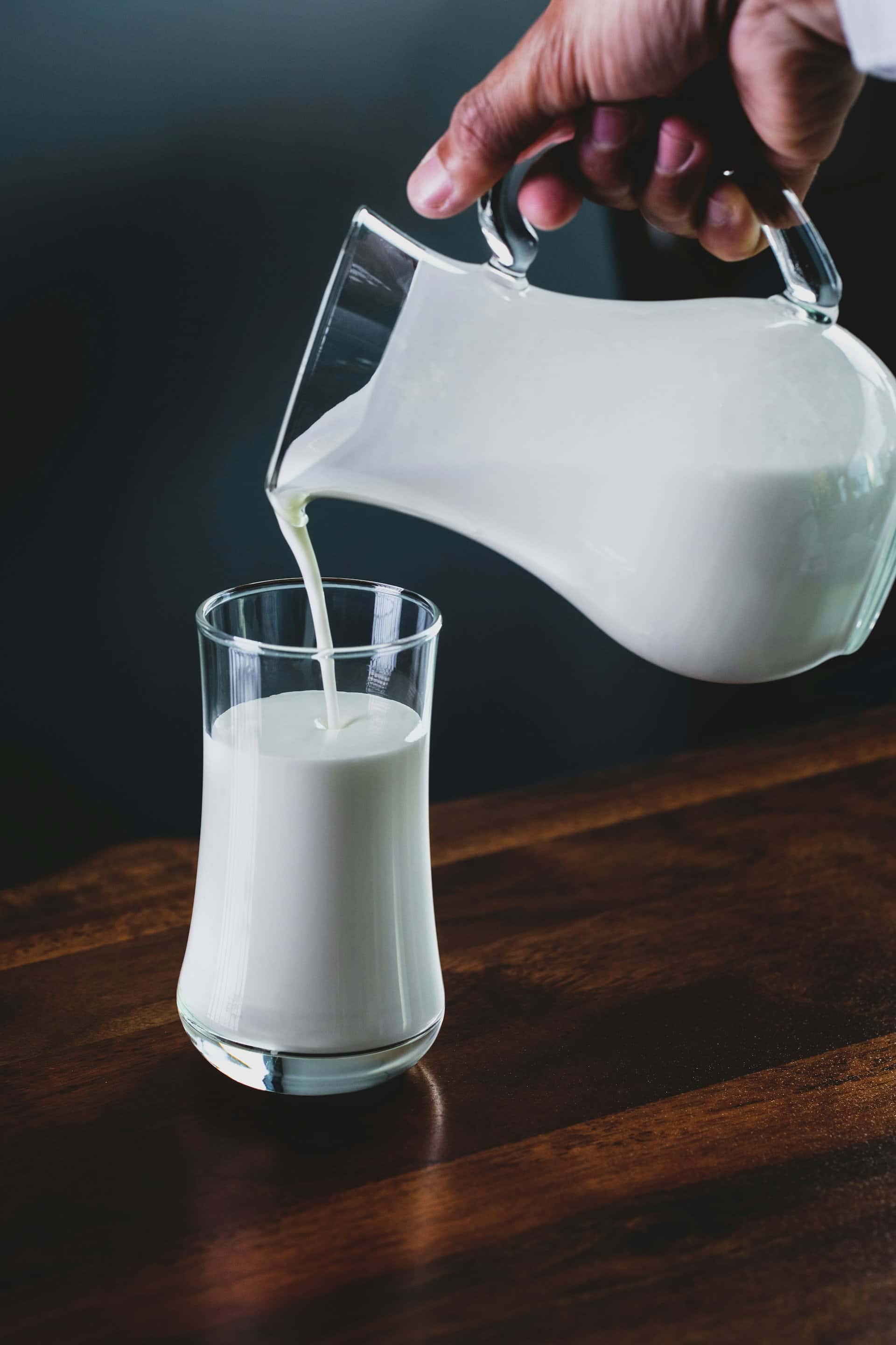 Fresh milk being poured into a glass — dairy product safety