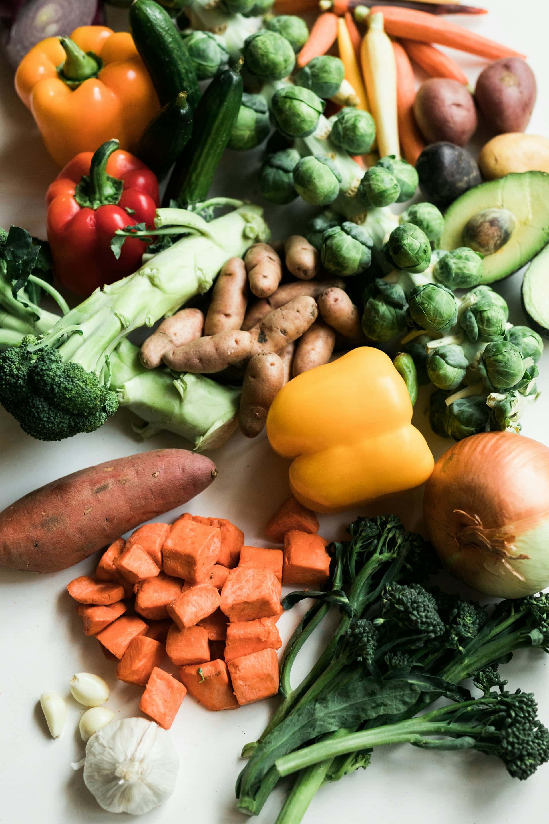 Fresh organic vegetables including peppers, potatoes and broccoli